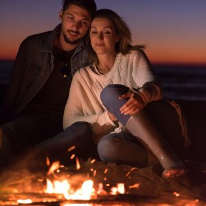 portrait-of-young-couple-enjoying-at-night-on-the-beach-e1631510574684.jpg